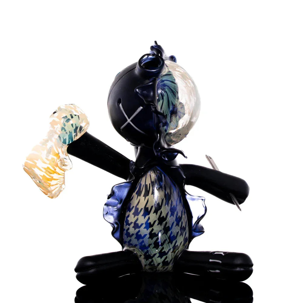 Handcrafted glass art doll with houndstooth pattern and abstract colorful accents