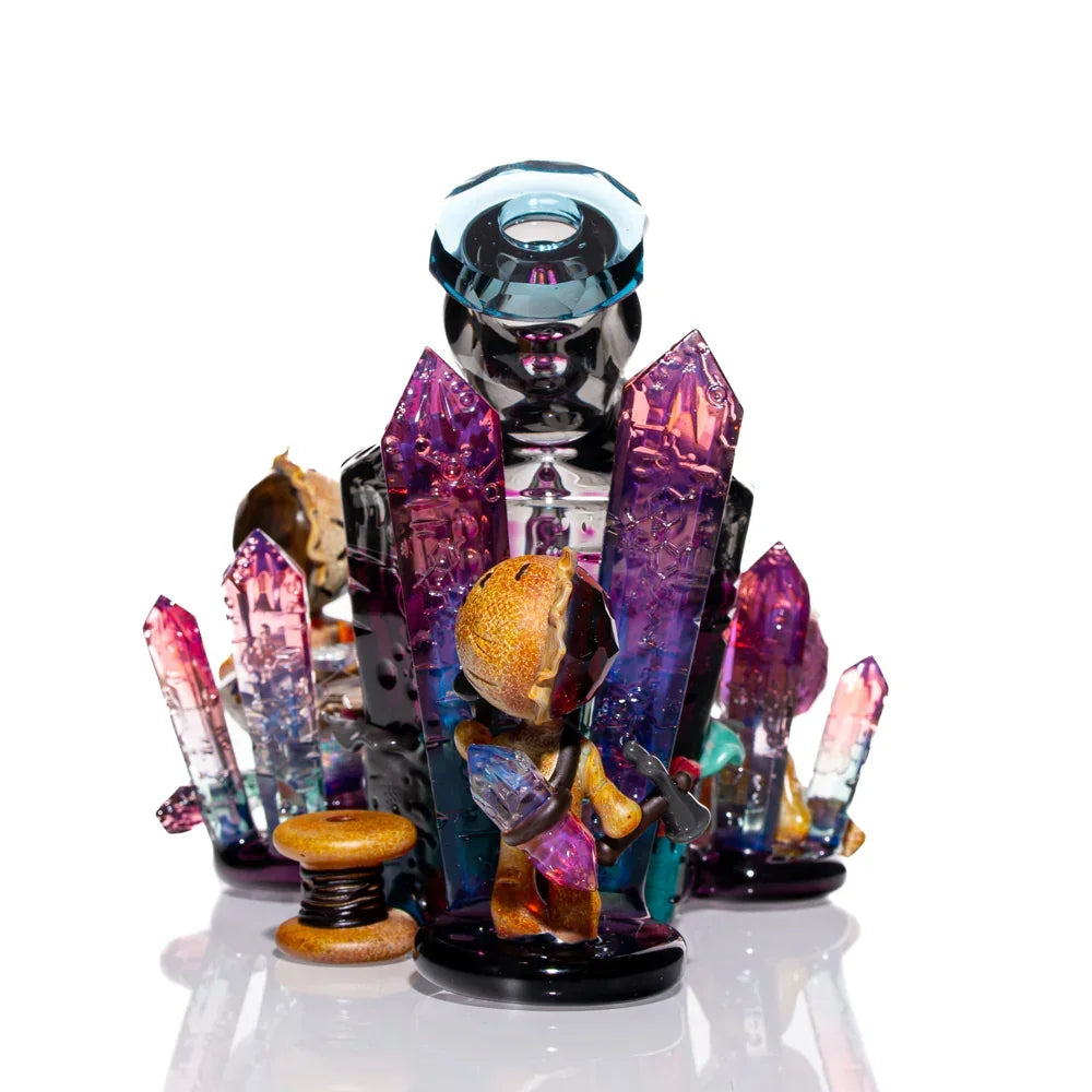 Heady glass art pipe with vibrant crystal clusters and miner figure on white background