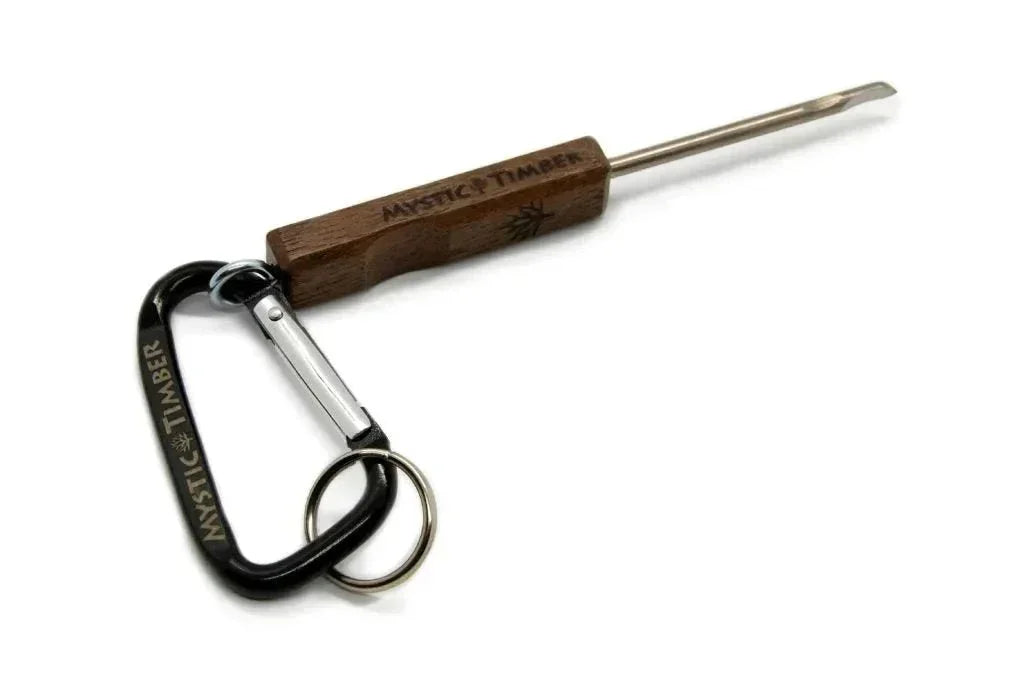 Walnut wood dab tool with engraved handle, metal tip, and black carabiner keychain attached.