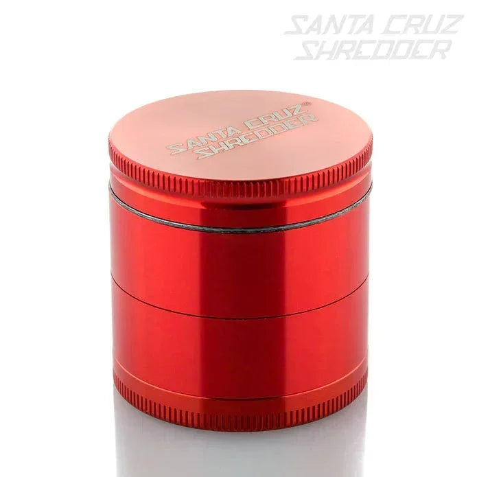 Red Santa Cruz Shredder herb grinder with engraved logo, sleek cylindrical design