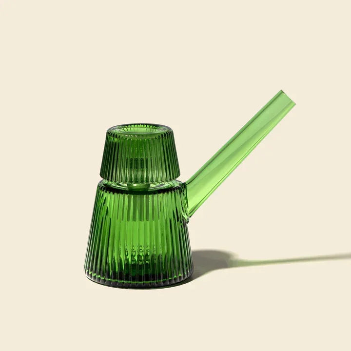 Emerald green ribbed glass bubbler with angled mouthpiece on neutral background