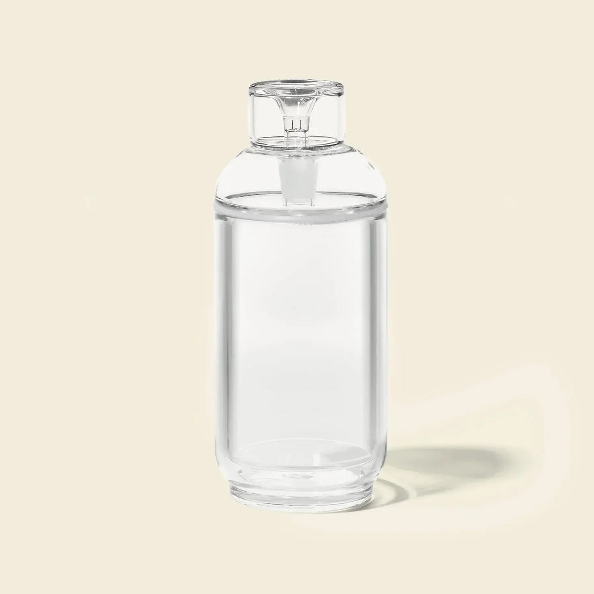 Clear glass gravity bong with cylindrical design on light background