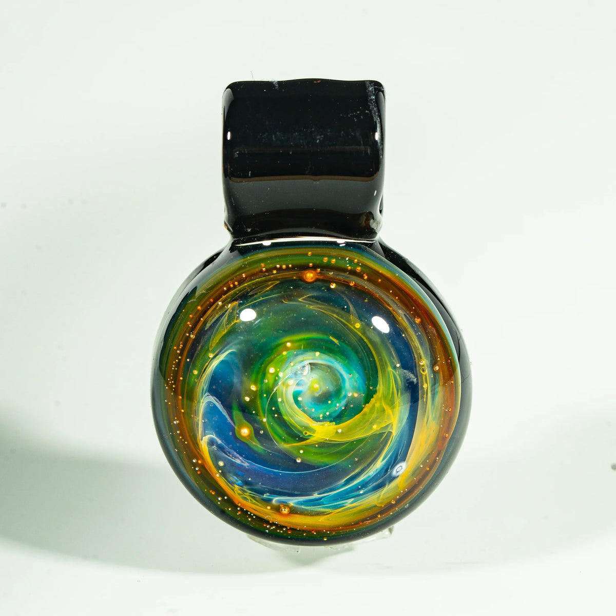 Heady glass pendant with swirling nebula design in blue, green, and yellow tones
