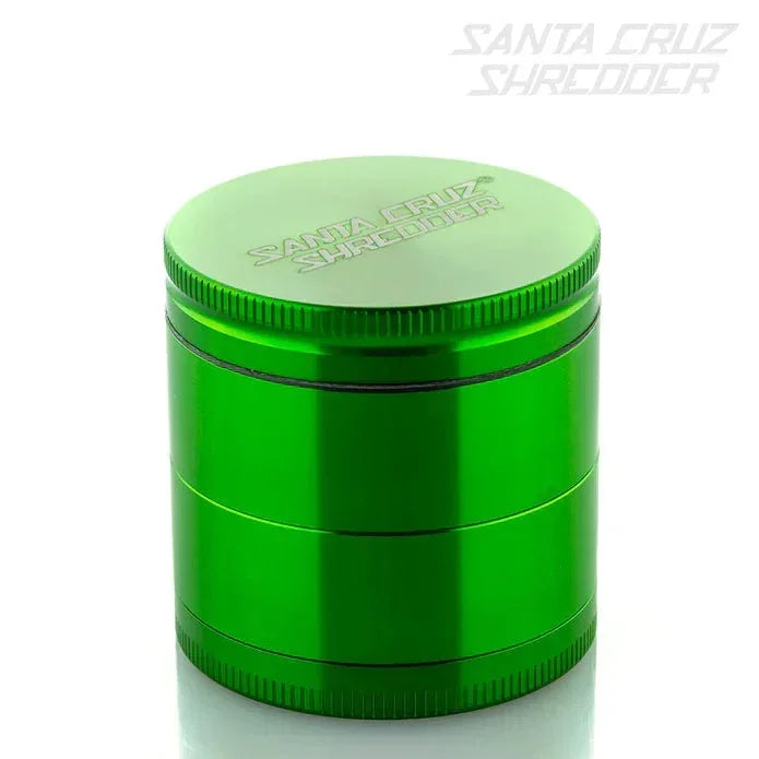 Green metal Santa Cruz Shredder herb grinder with engraved logo on white background