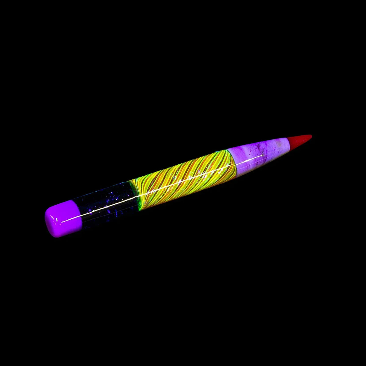 Colorful dichroic glass pencil with neon swirls and purple tips on black background