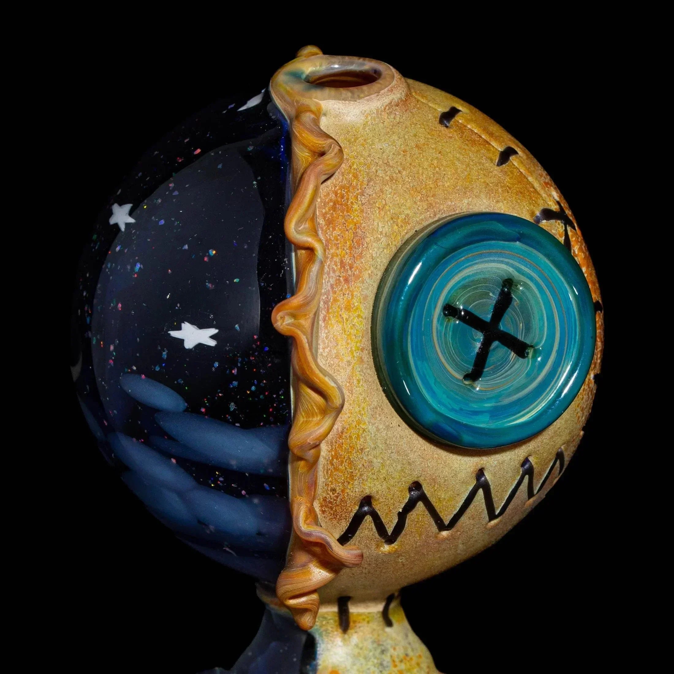 Unique glass art piece featuring a half-night sky, half-button-face round design on black background