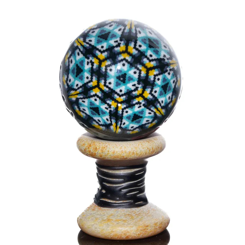 Colorful marble-patterned glass sphere with stand, intricate blue and yellow design