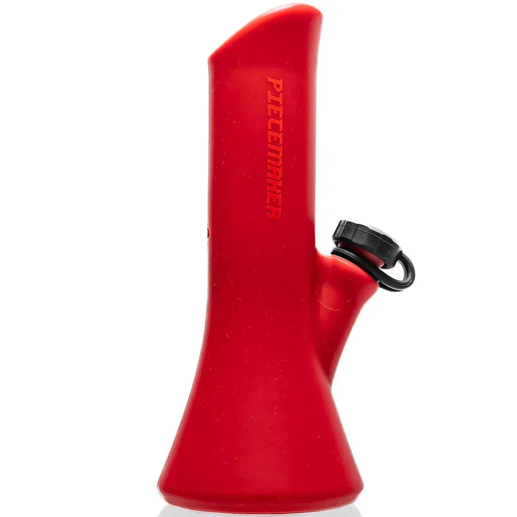 Red silicone portable bong with side cap and modern design, PieceMaker logo visible