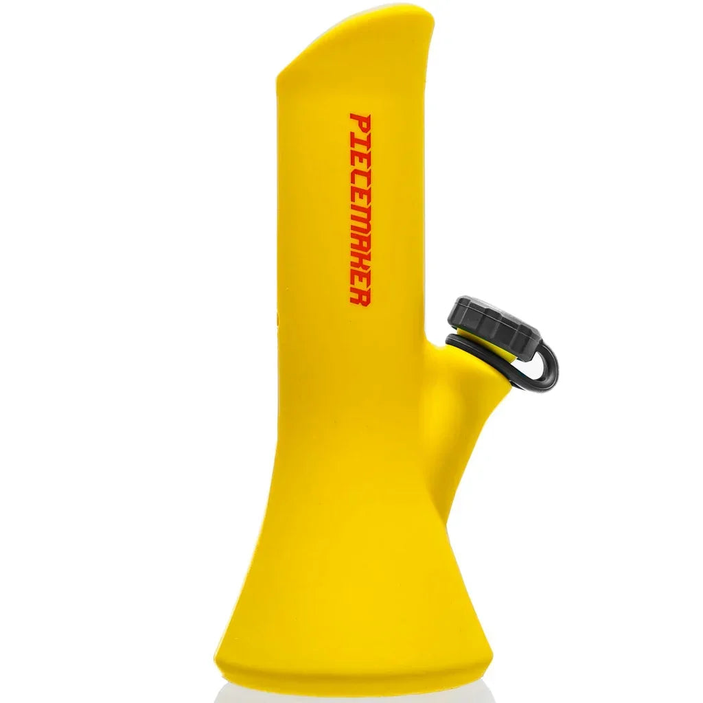 Yellow silicone PieceMaker portable water pipe with black lid and red logo
