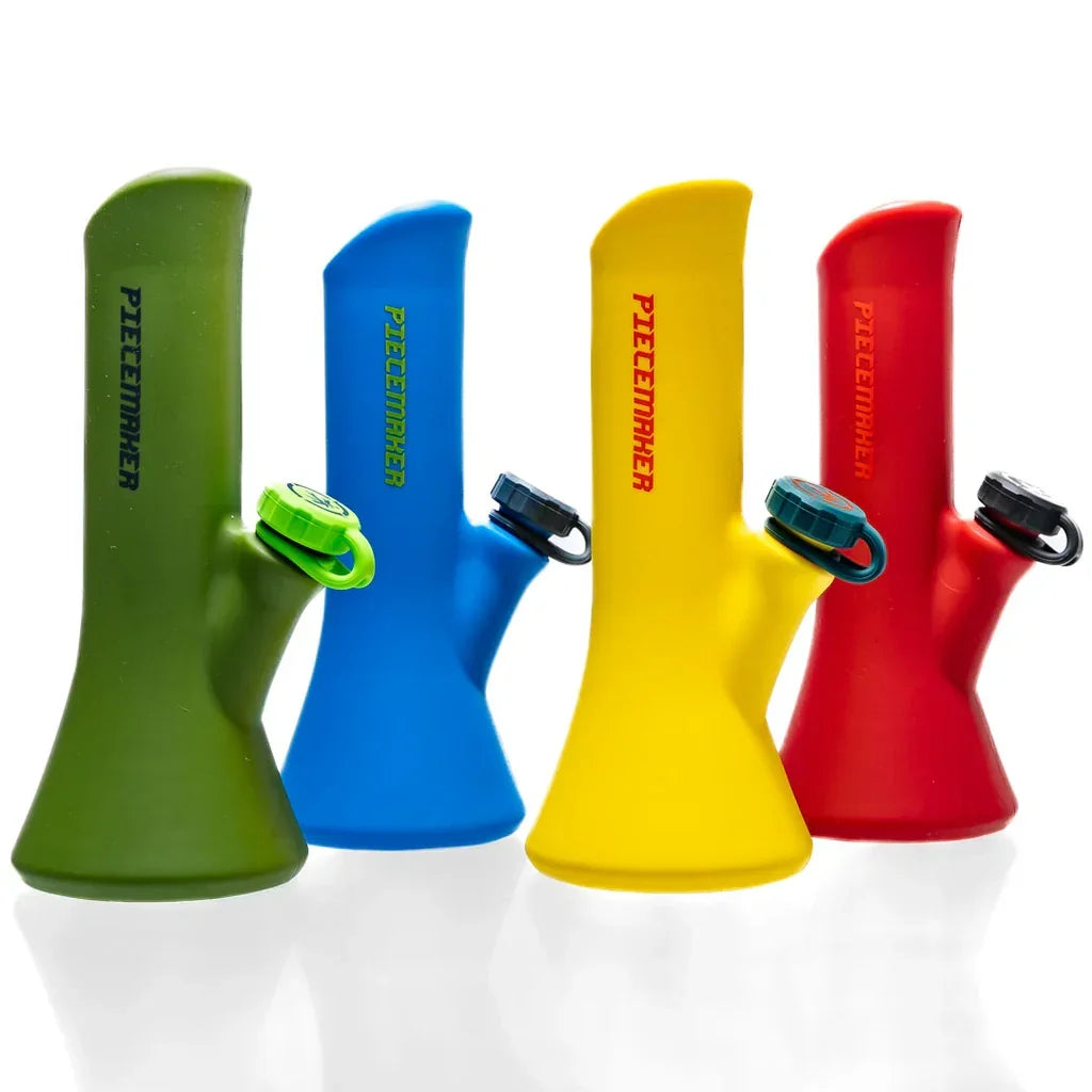 Four colorful silicone water pipes in green, blue, yellow, and red with PIECEMAKER logo.