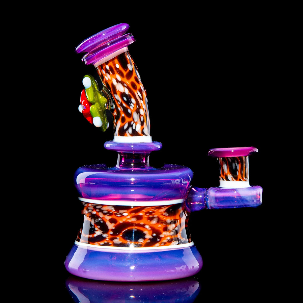 Colorful mini glass water pipe with vibrant purple, orange, and patterned accents