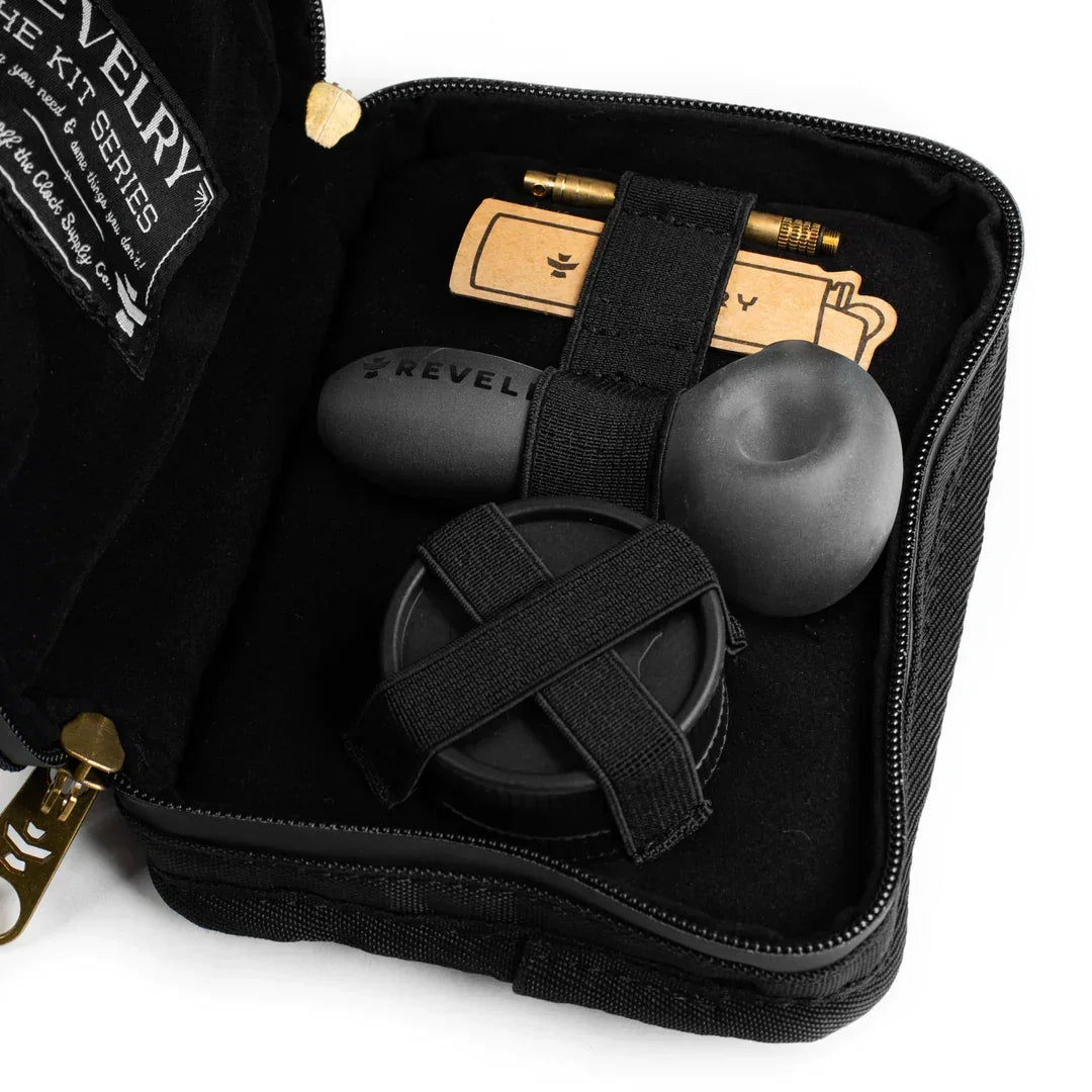 Black travel pipe kit with metal smoking pipe, grinder, and accessories in zippered case