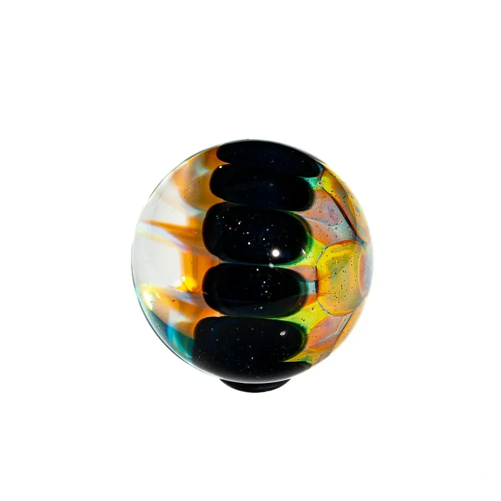 Handcrafted glass marble featuring silver fume, blue stardust, and multi-color swirls