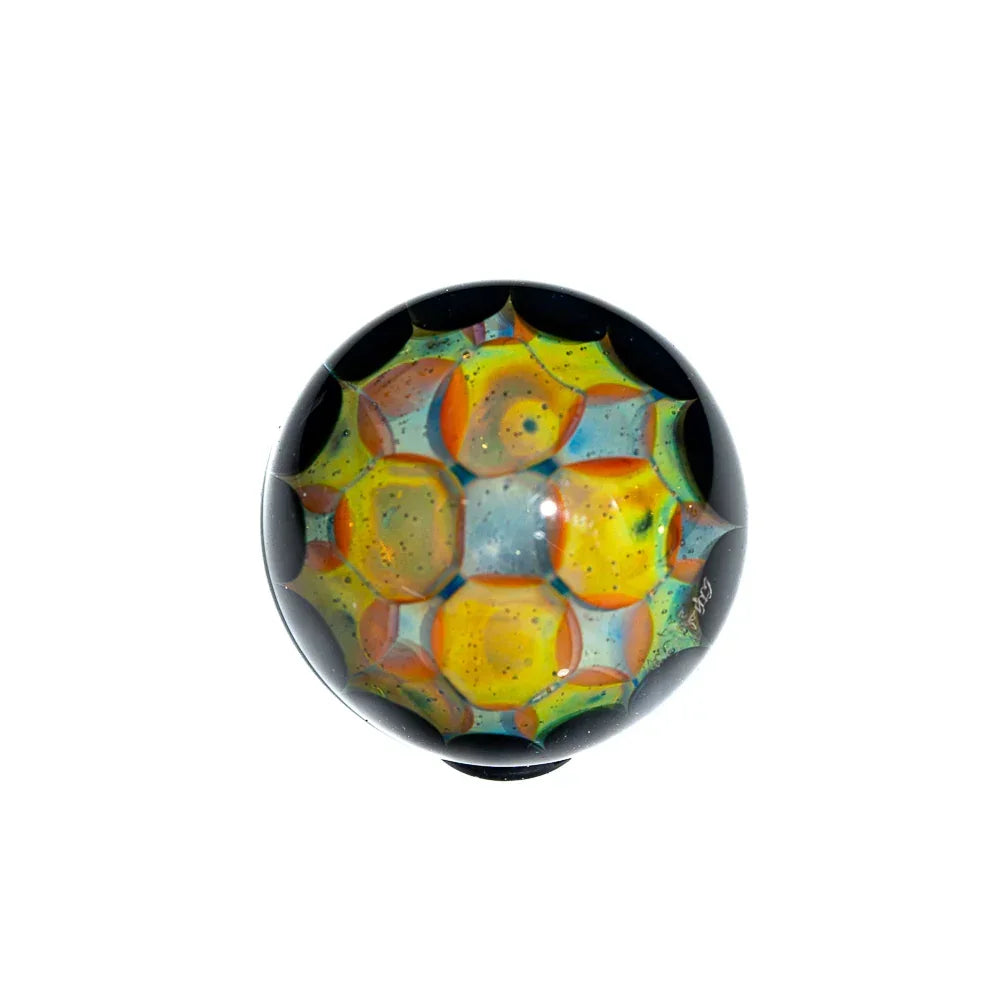 Silver fume glass marble with blue stardust pattern and geometric yellow accents