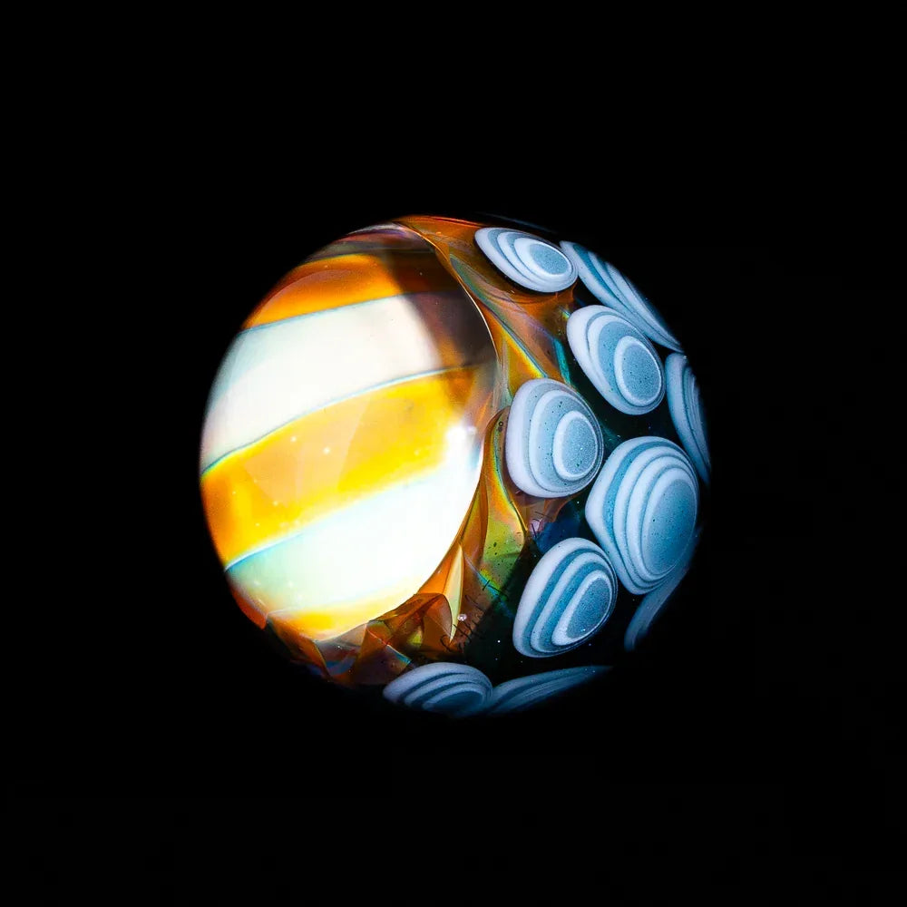 Handmade glass marble with silver fume, spiral vortex design, blue and orange accents