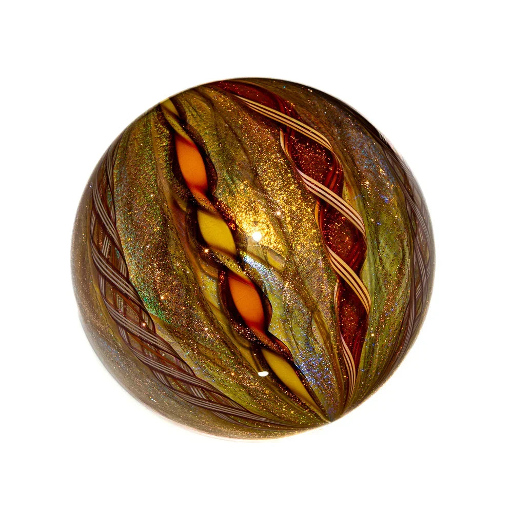 Handcrafted gold and amber glass marble with swirling glitter and intricate patterns