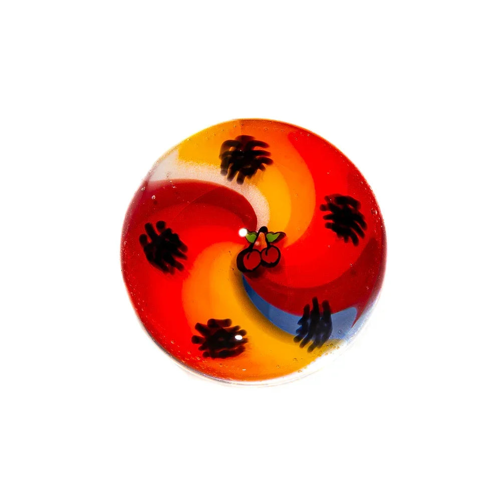 Colorful glass carb cap with red, orange, and yellow swirl pattern and cherry design