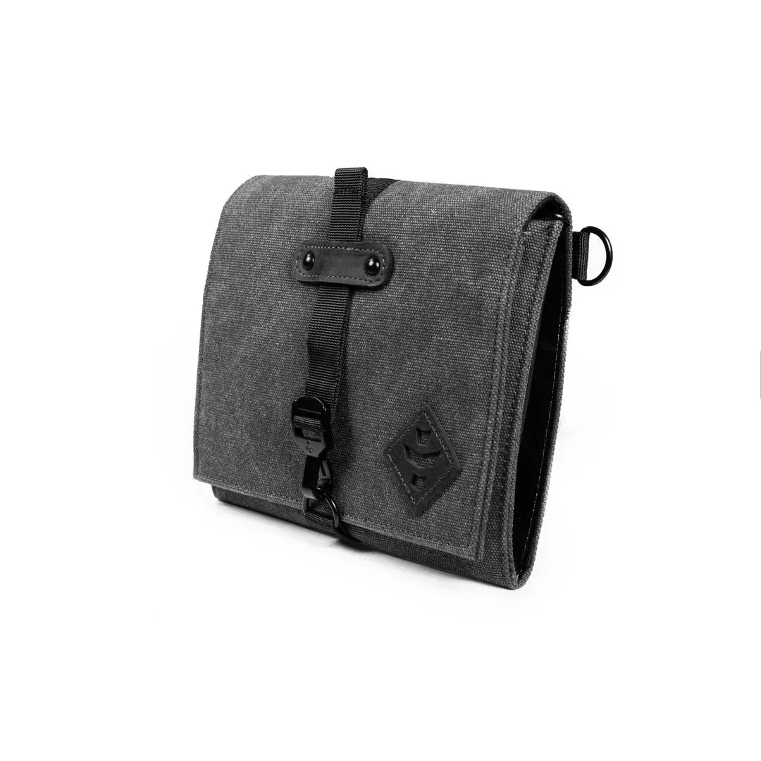 Black canvas rolling kit bag with buckle closure and small logo, on white background