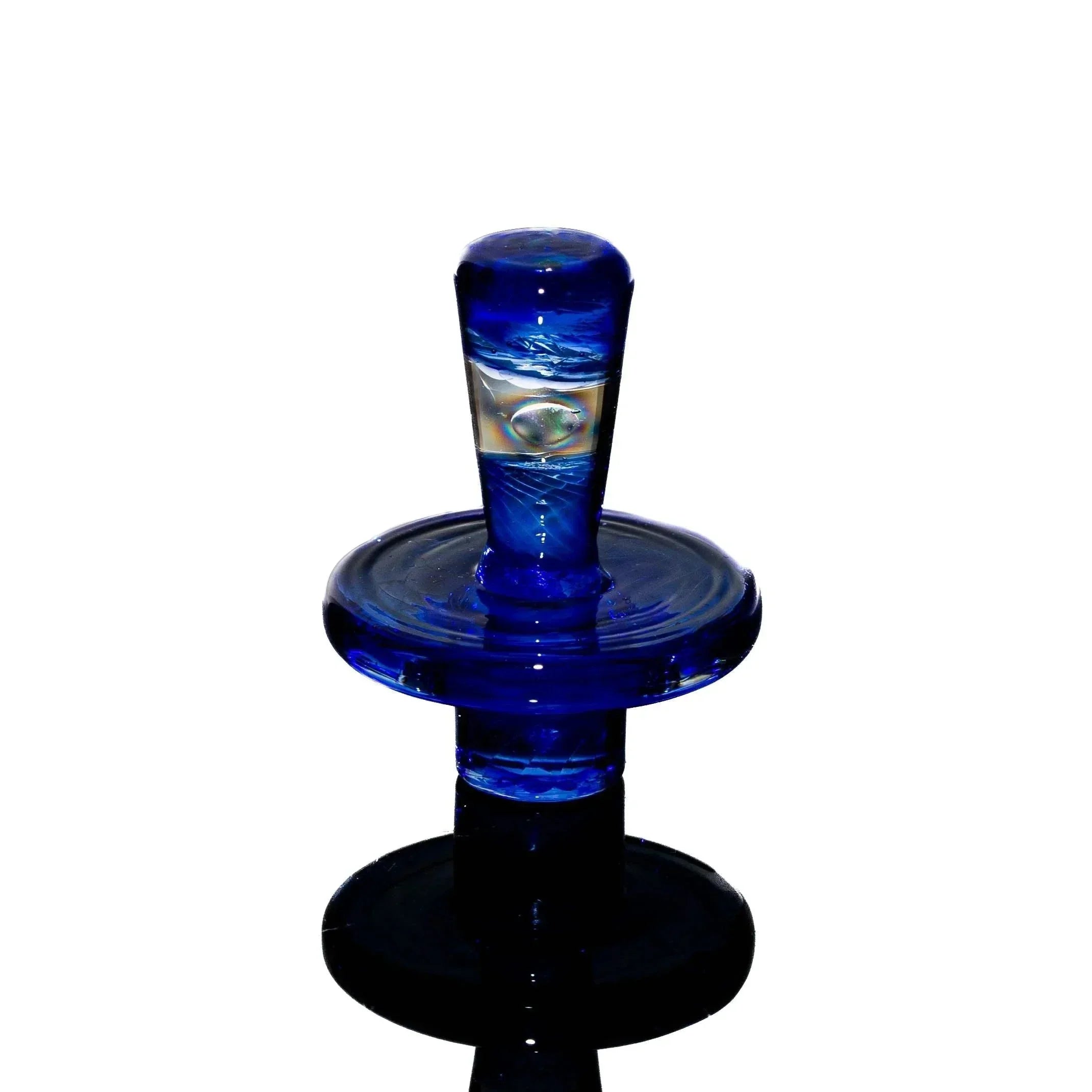 Blue glass carb cap with clear opal accent on white background, smoking accessory