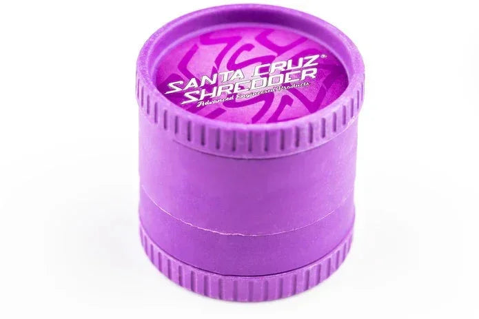 Purple Santa Cruz Shredder 4-piece herb grinder with textured grip on white background