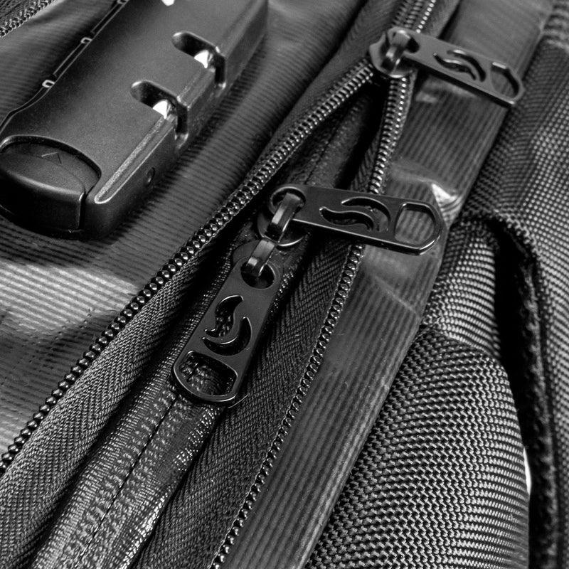 Close-up of black backpack zippers and built-in lock on durable textured fabric