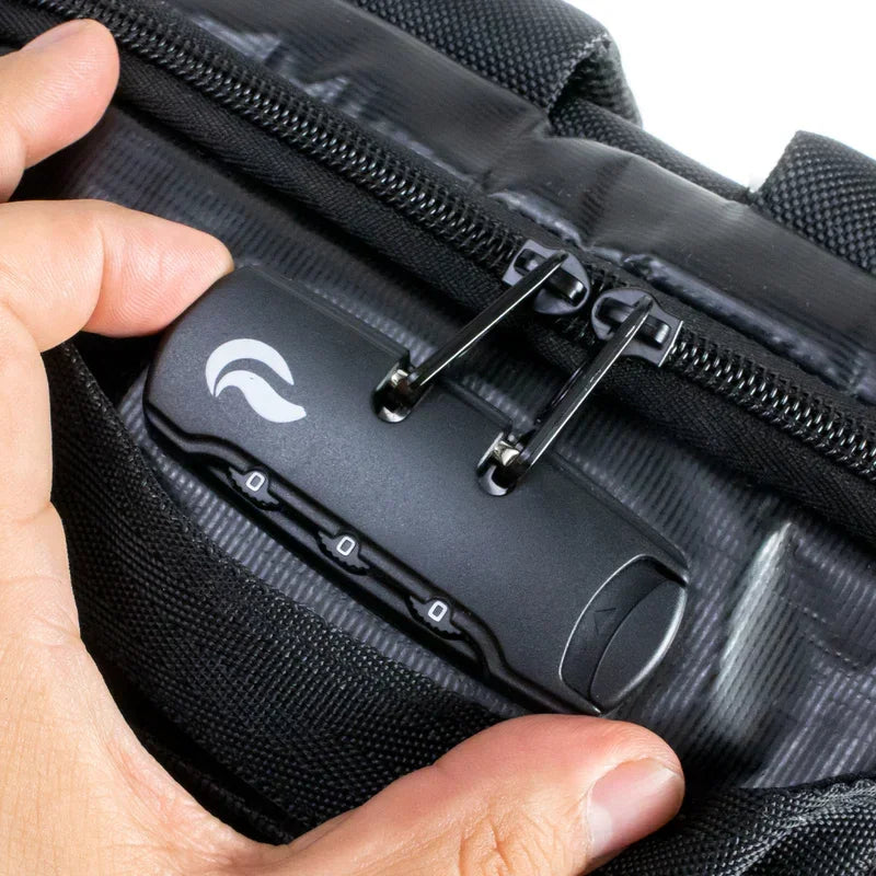 Close-up of hand using black combination lock on odor-proof zipper bag
