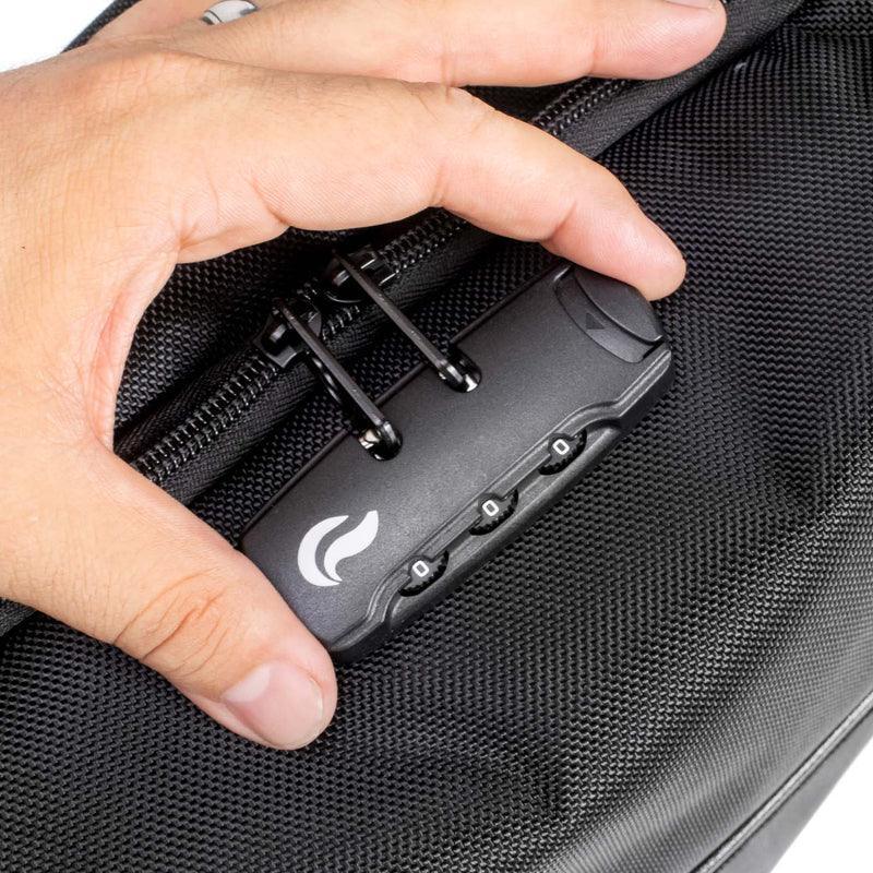 Close-up of hand holding black travel bag with zipper and built-in combination lock