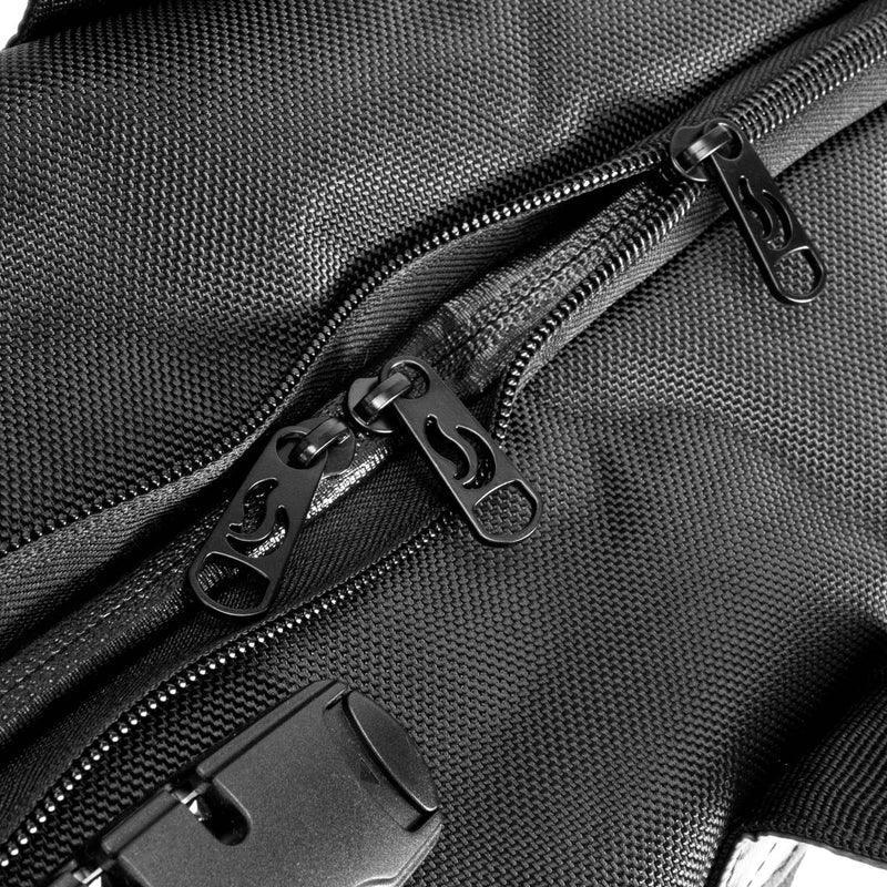 Close-up of black textured bag with multiple zippers and secure lock