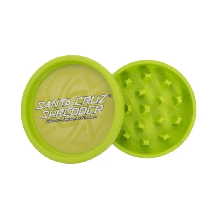Green two-piece hemp grinder with textured teeth and Santa Cruz Shredder logo on lid