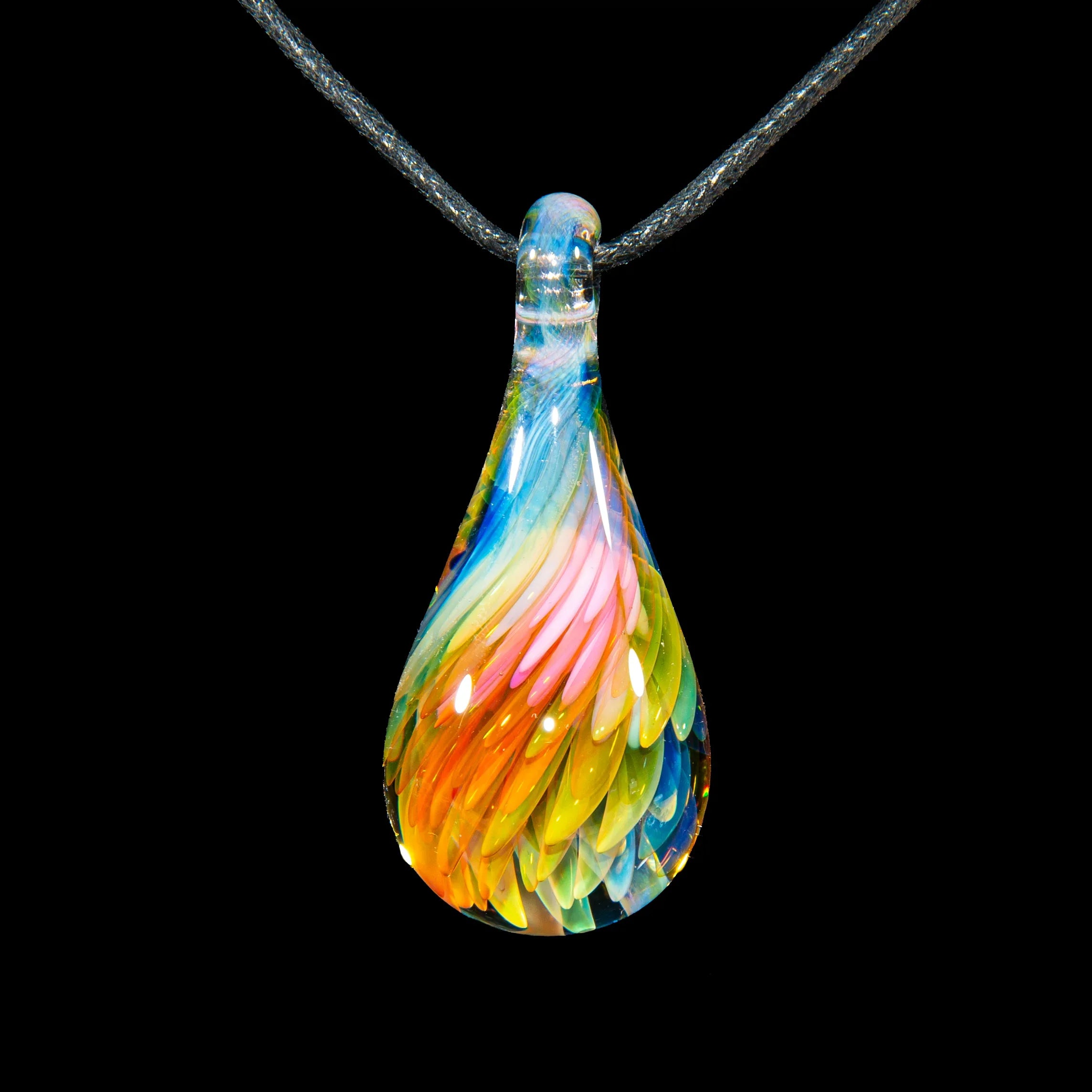 Colorful fume implosion glass teardrop pendant with swirling feather details on black cord