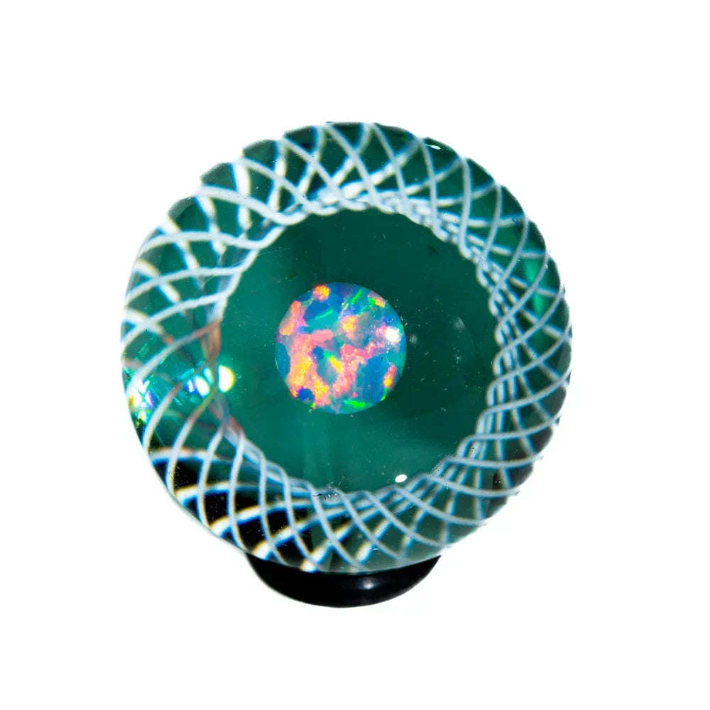 Handcrafted glass marble with colorful opal core and intricate swirling patterns