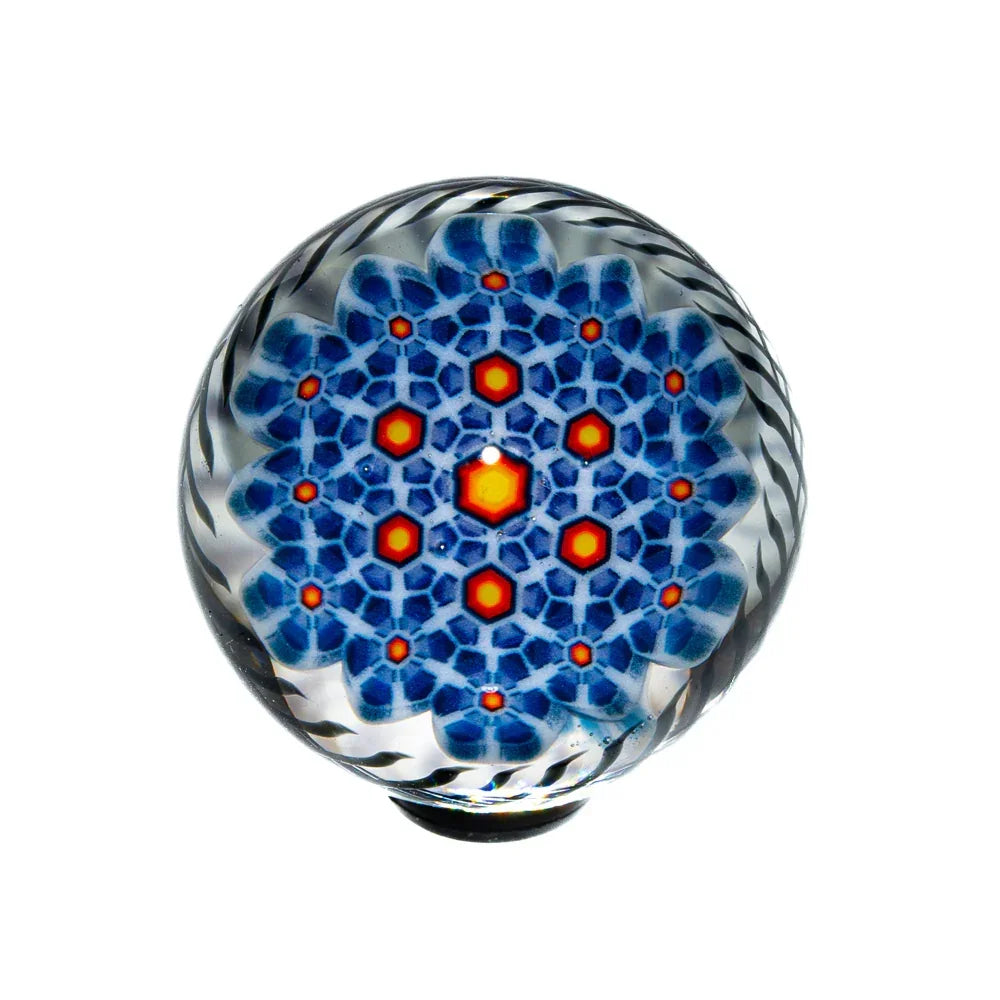 Intricate glass marble with blue and orange geometric pattern, heady art glass accessory