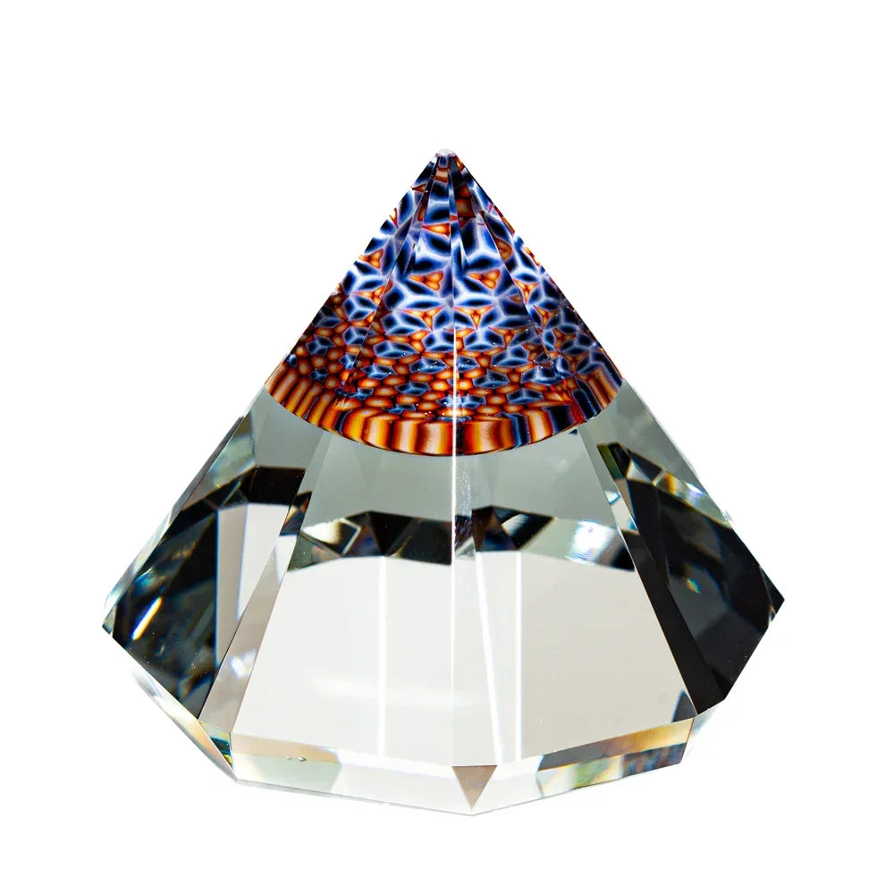 Faceted glass gem with intricate colorful patterns at the apex, displayed on white background.