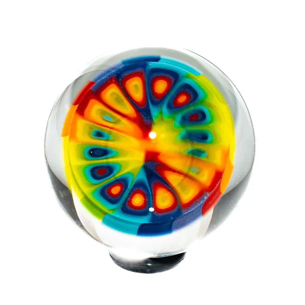 Colorful rainbow millefiori glass marble with intricate psychedelic pattern, white background