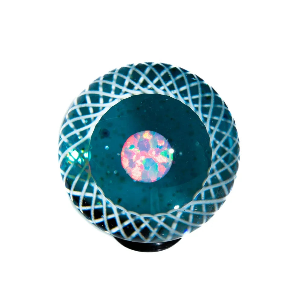 Blue glass marble with intricate white latticework and opal centerpiece