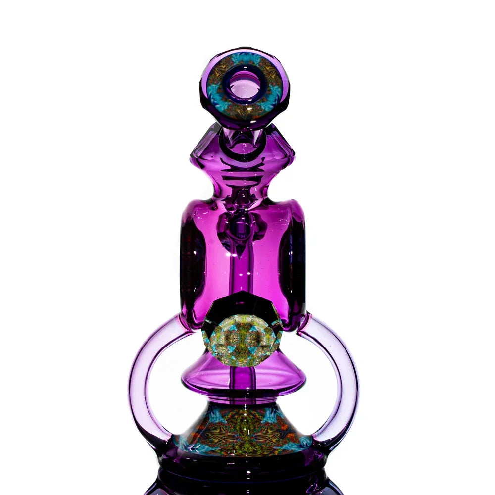 Purple heady glass water pipe with intricate colorful marbles and decorative accents