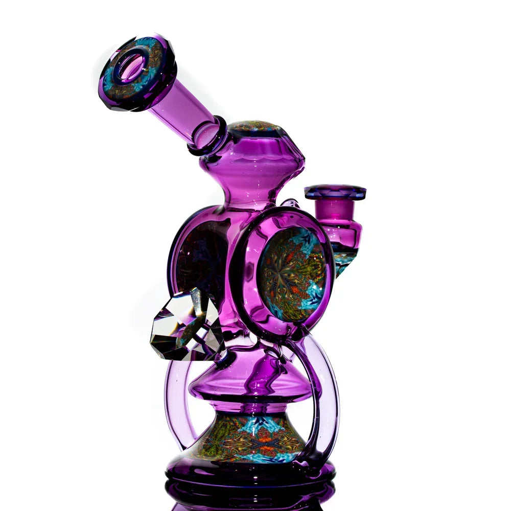 Purple heady glass water pipe with intricate designs and colorful accents on white background.