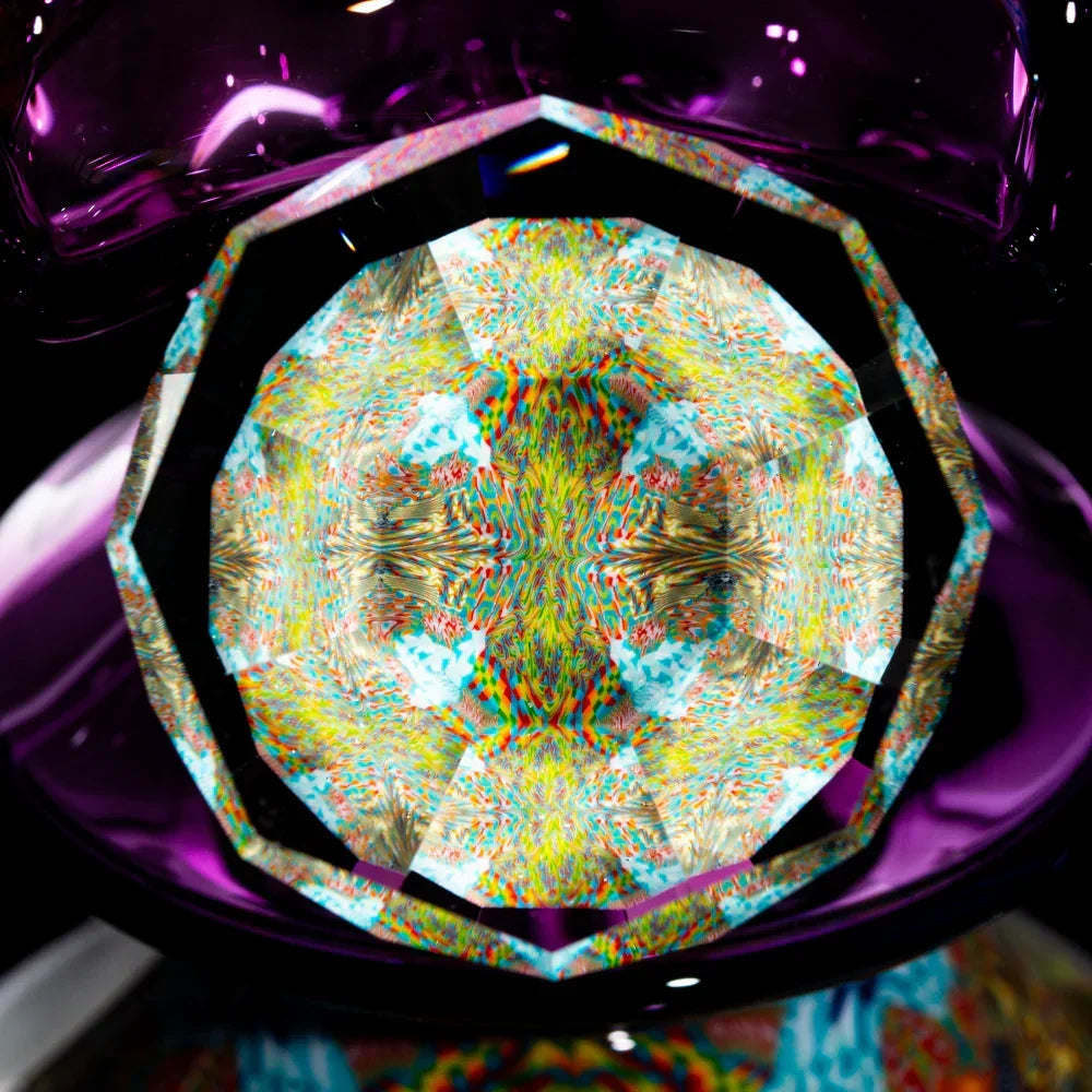 Close-up of a multicolored glass pipe with intricate kaleidoscopic patterns and purple accents