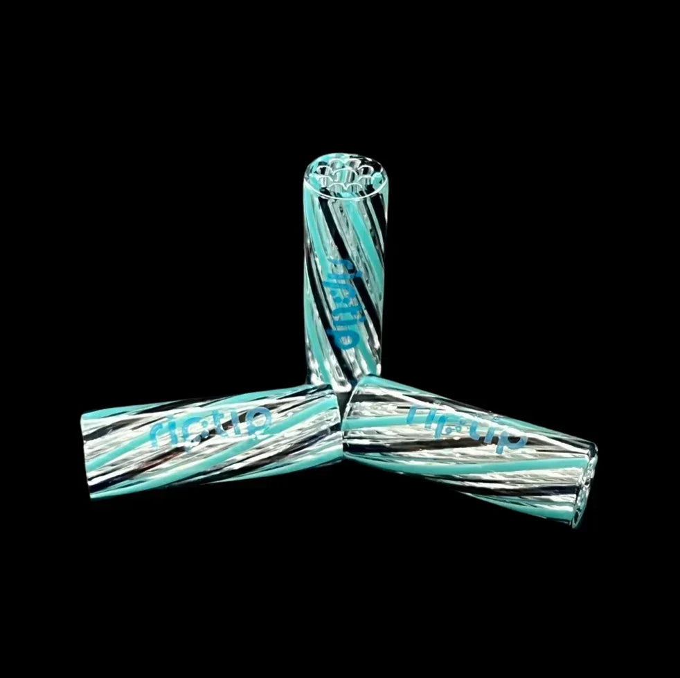 Three turquoise and clear glass filter tips with spiral design on black background