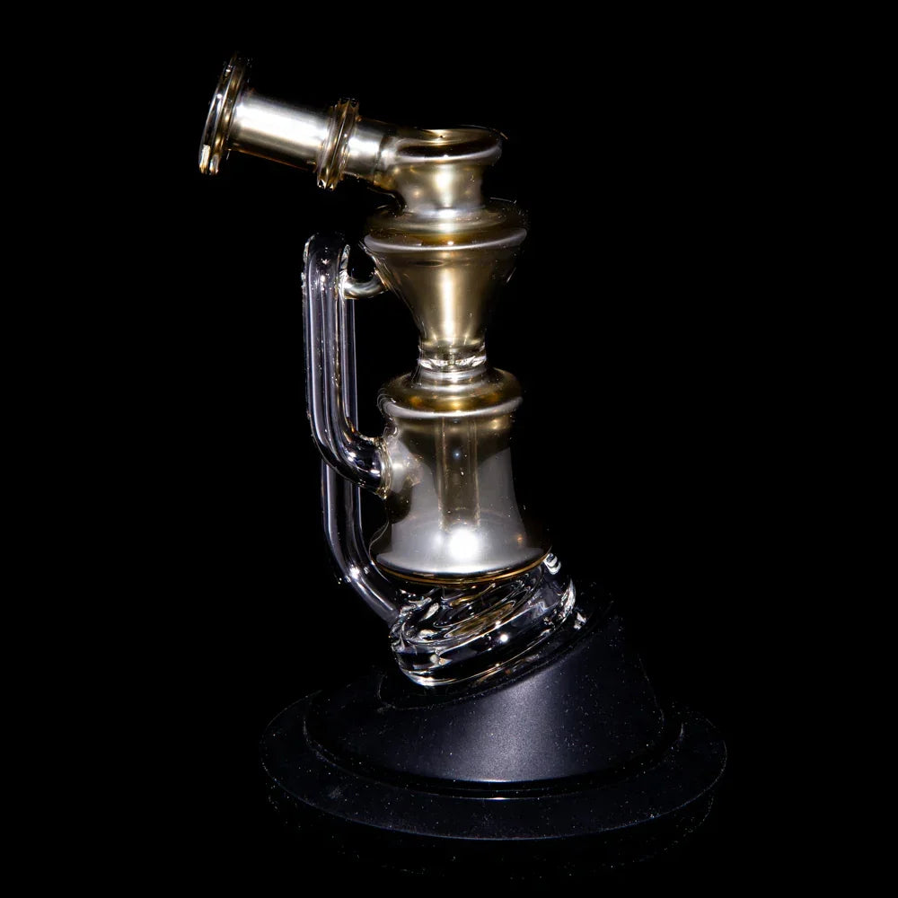 Gold and clear glass recycler water pipe with curved neck on black background