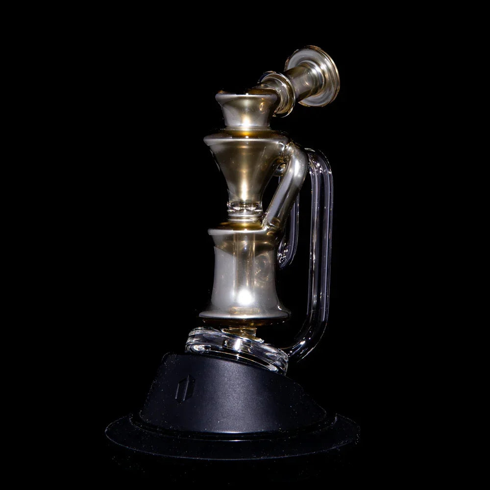 Electrum Peak Recycler glass water pipe with metallic finish on black background