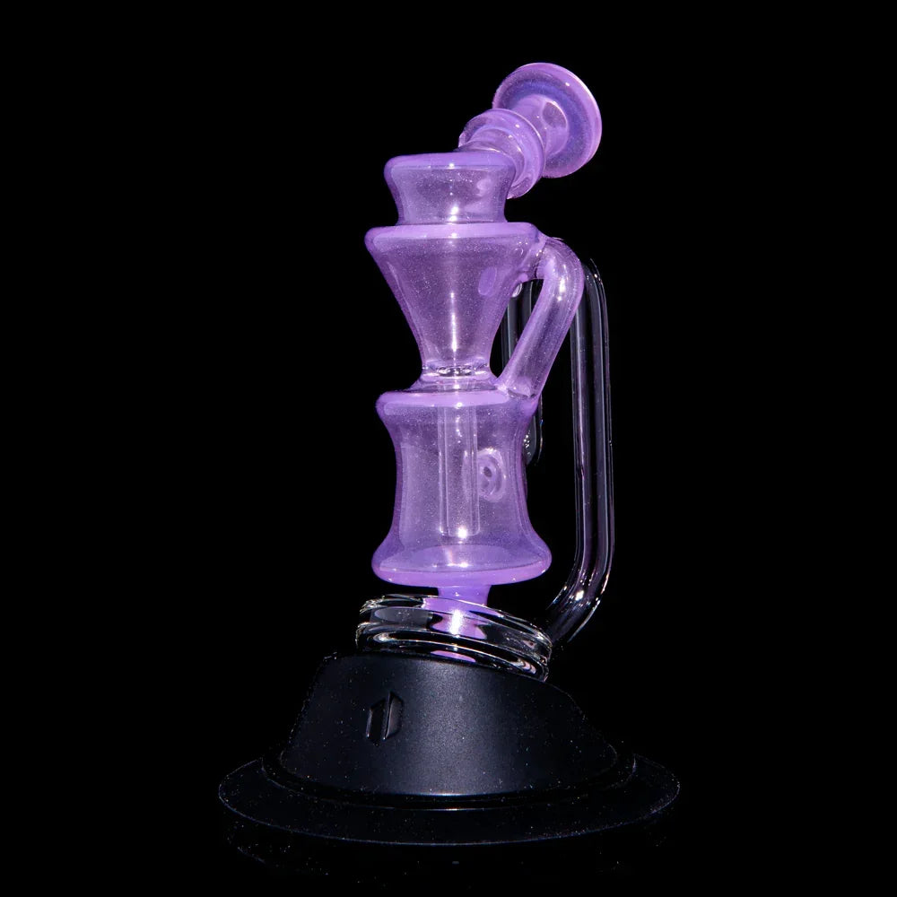 Purple glass recycler attachment for vaporizer, displayed on a black background.