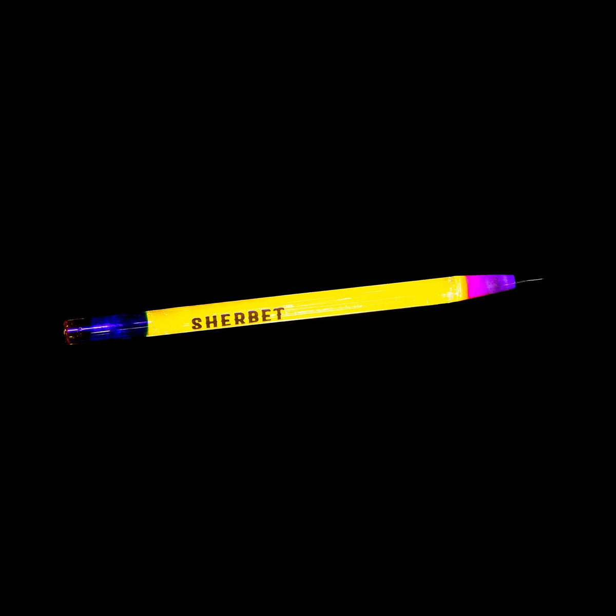 Yellow glass dab tool labeled SHERBET with blue and pink ends on black background