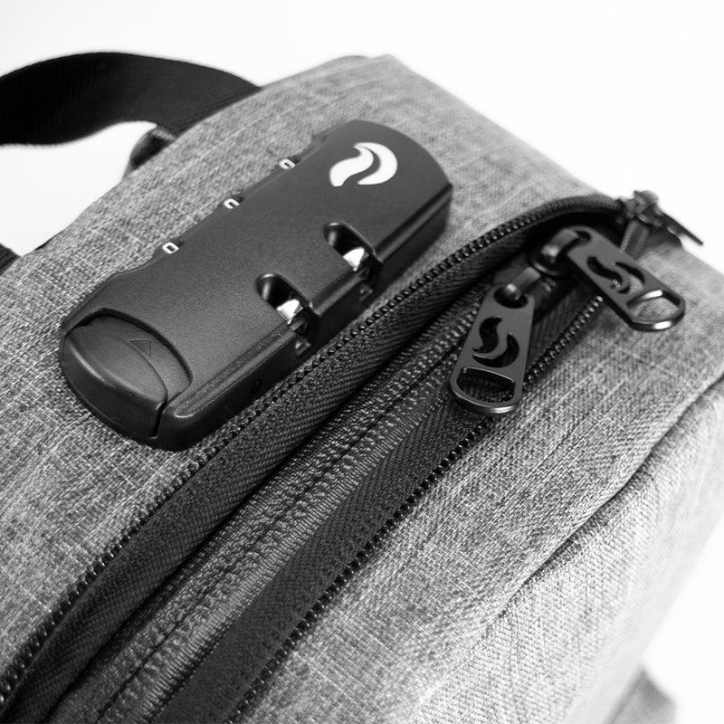 Close-up of a gray smell-proof bag with combination lock and double zipper detail