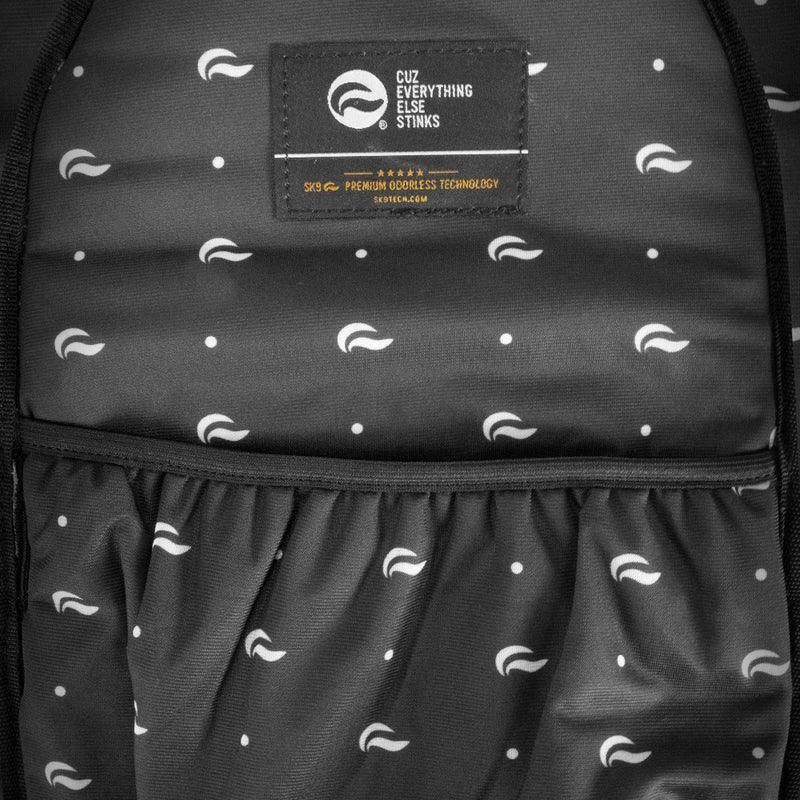 Close-up of odor-proof backpack interior with elastic pockets and black-and-white patterned lining.