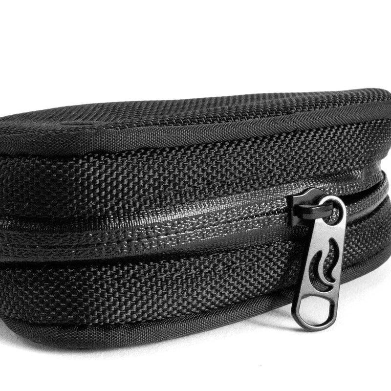 Black smell-proof travel case with textured fabric and secure zipper close-up