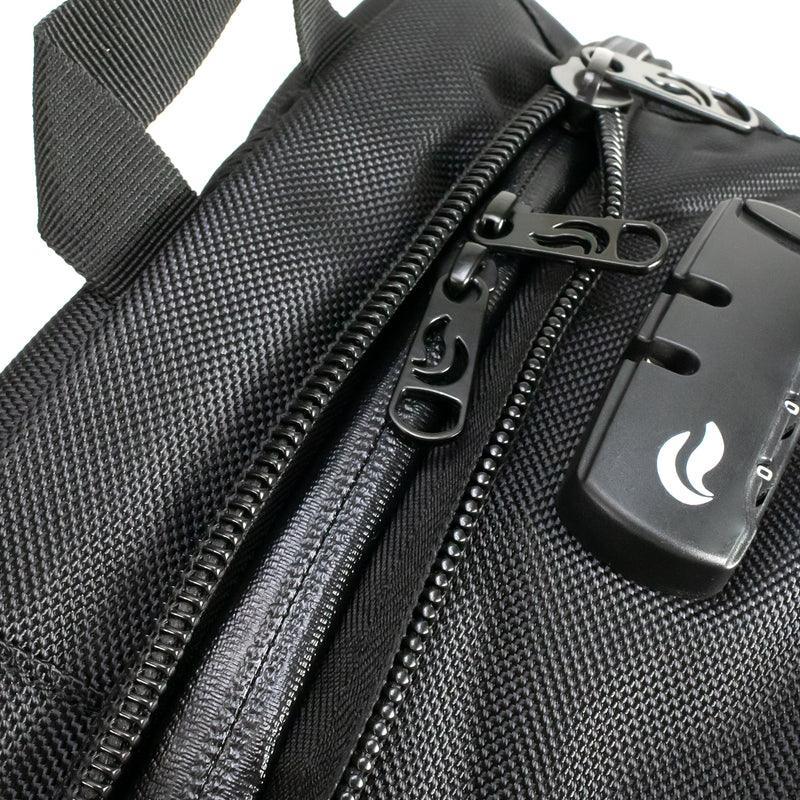 Close-up of black odor-proof bag with lock, zippers, and textured fabric
