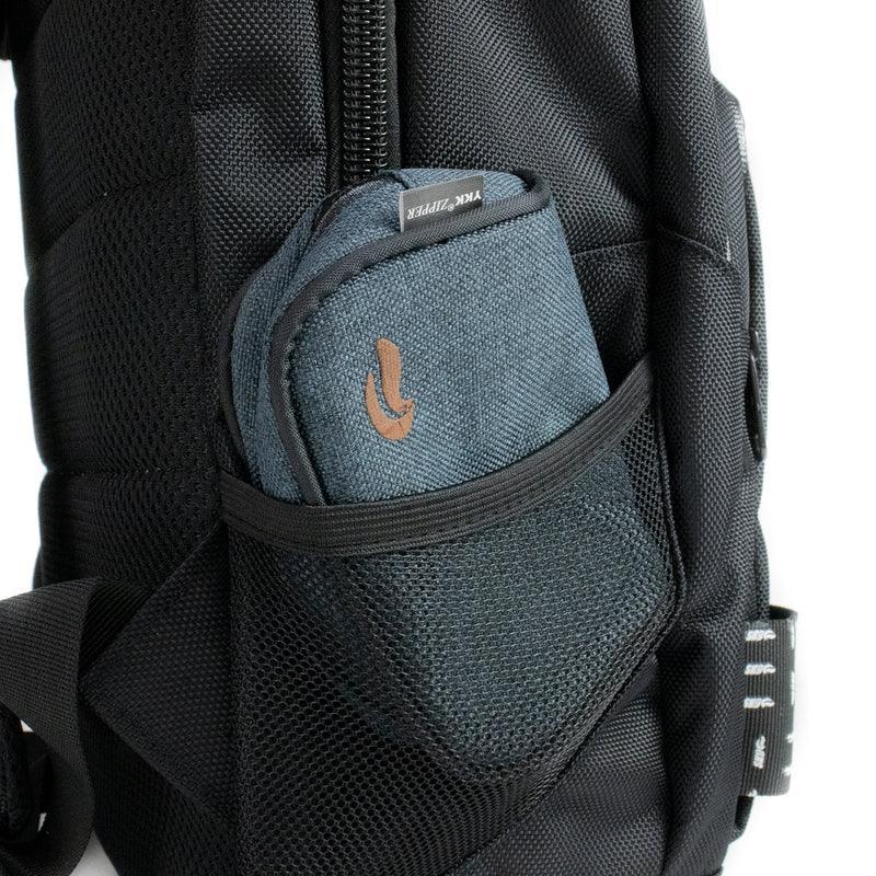 Close-up of black backpack with small blue zippered pouch in mesh side pocket