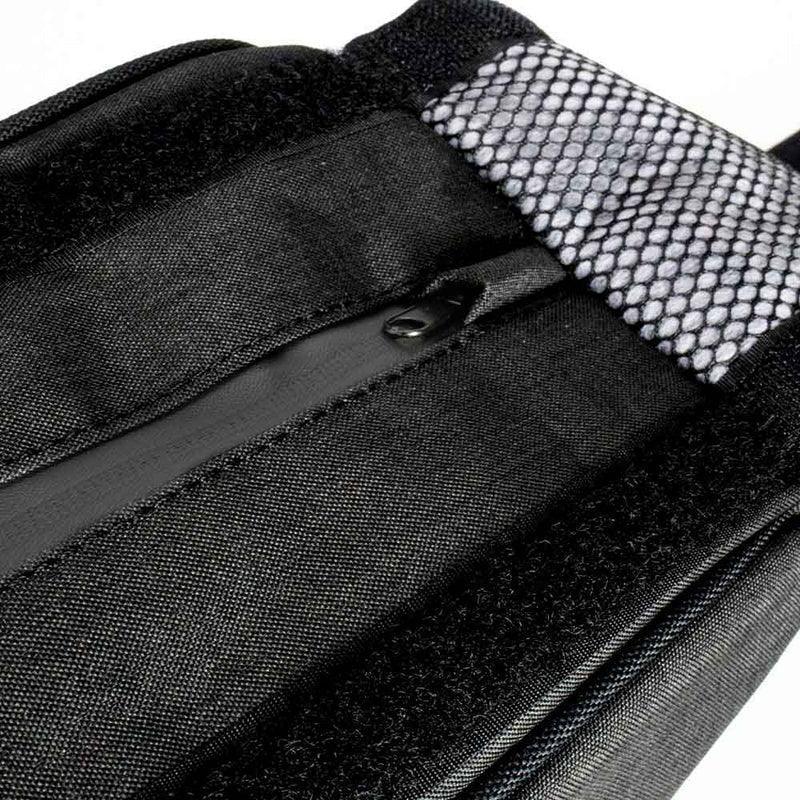Close-up of charcoal travel bag with mesh pocket, zipper, and Velcro strap