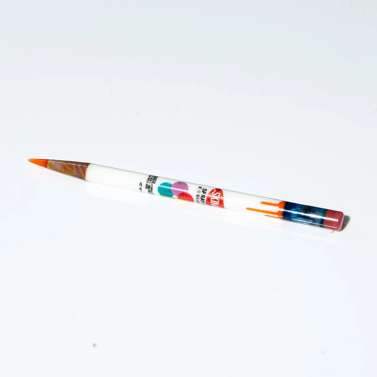 Colorful glass dab tool with orange tip and artistic designs on a white background